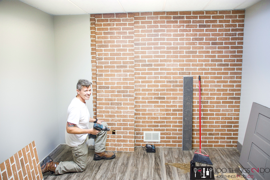Details Renovations installing faux brick wall